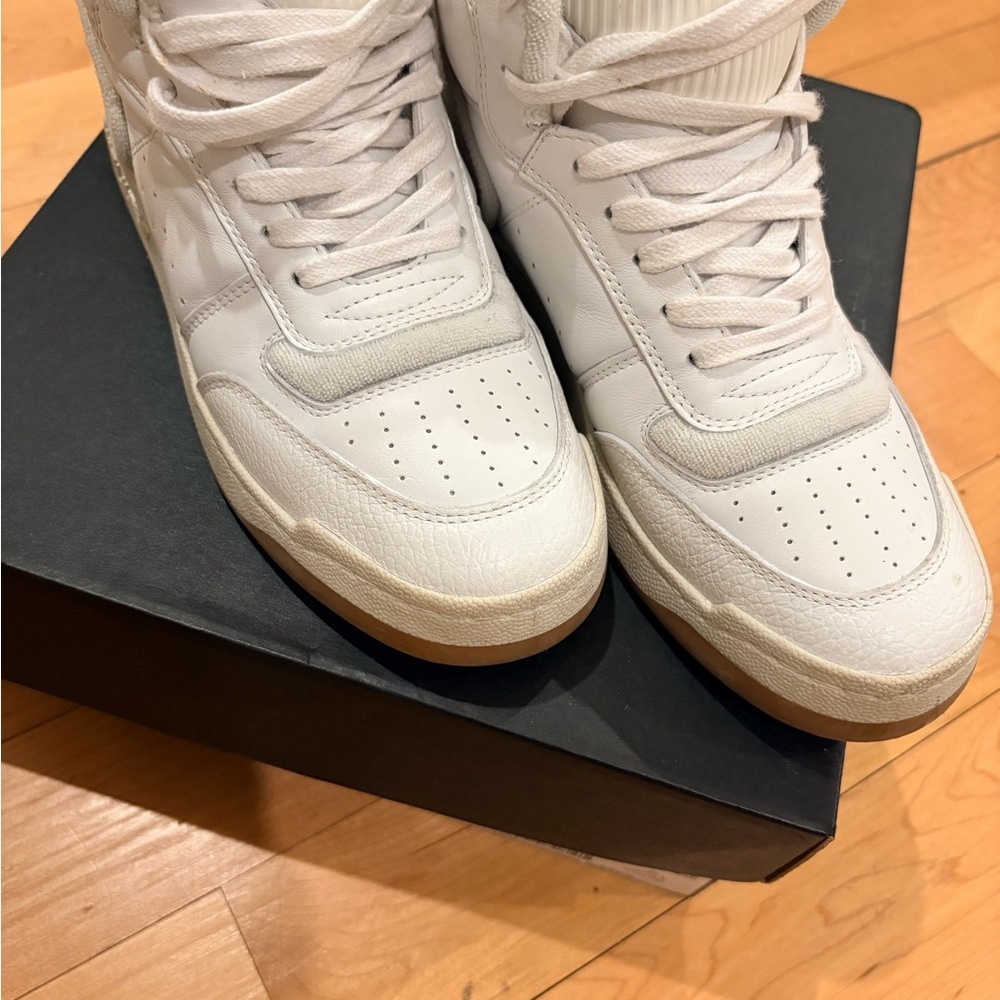 Woman’s White High-Top Sneakers